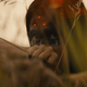 A young Comanche Warrior raises her bow, only to find a triangular, 3-dot laser sight trained on her forehead.